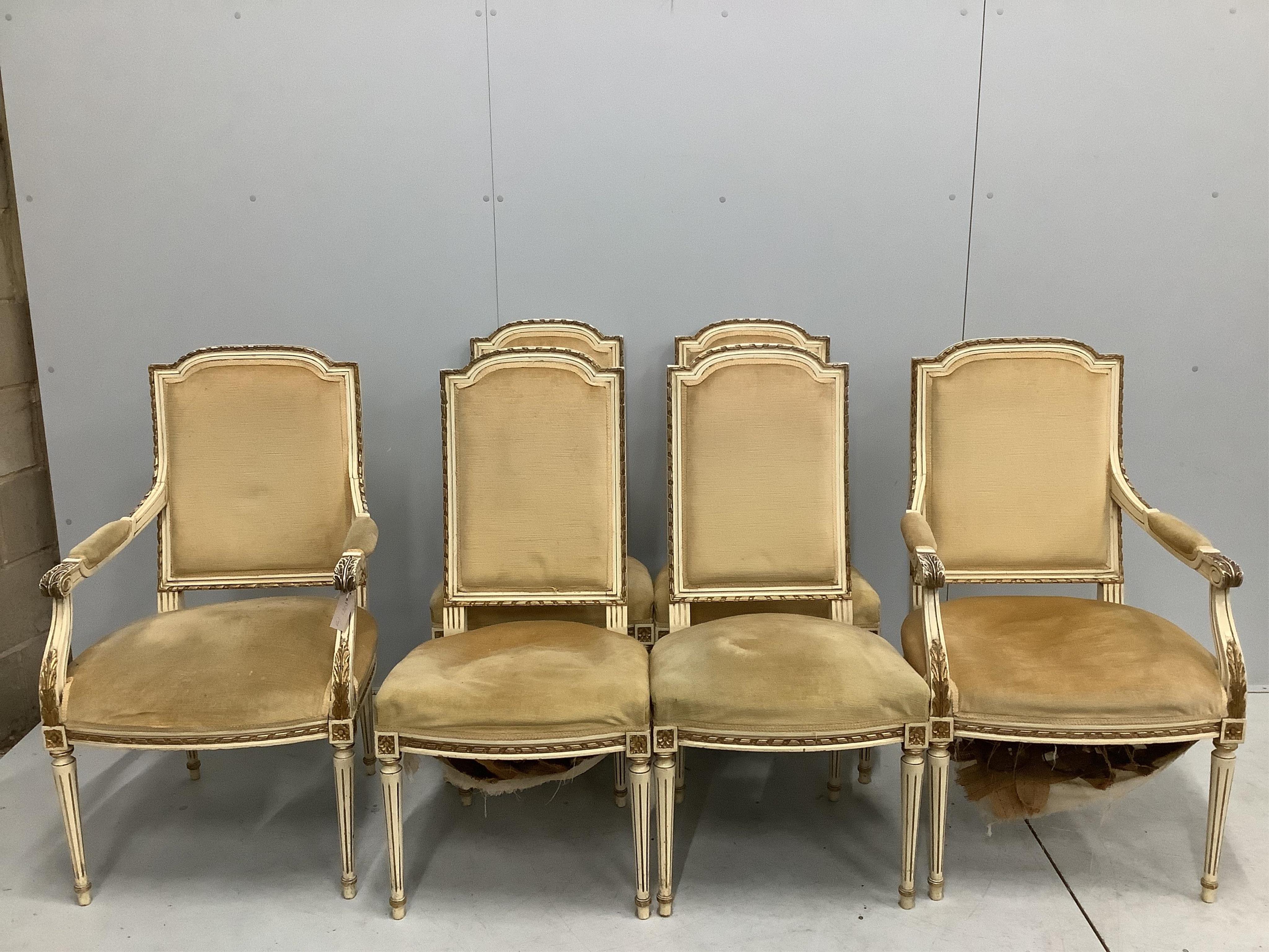 A set of six Louis XVI style cream and parcel gilt carved wood dining chairs, two with arms. Condition - fair